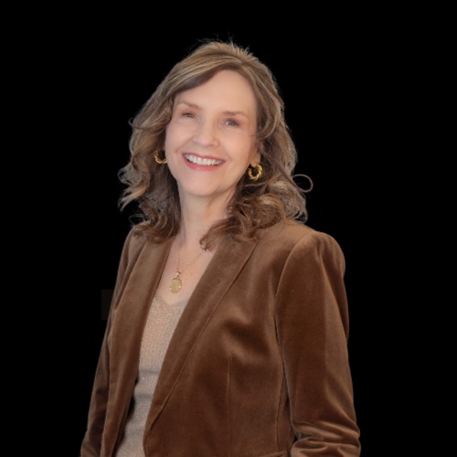 Christina Pizanias, salesperson at Mountain Ridge Realty, LLC. , wearing a black dress jacket over a white shirt