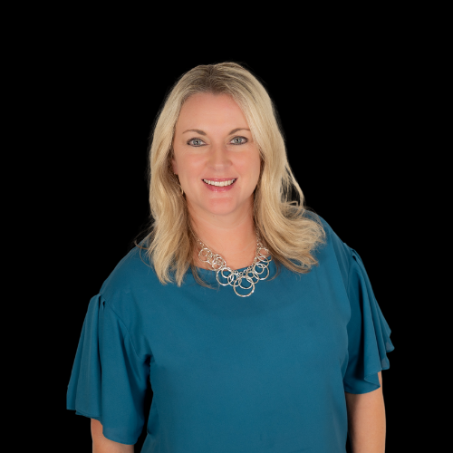 Stephanie Lemley, broker at Mountain Ridge Realty, LLC. , wearing a dark blue dress